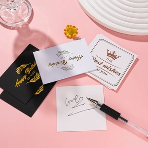 Detailed view of elegant gold-stamped greeting cards for birthdays and best wishes
