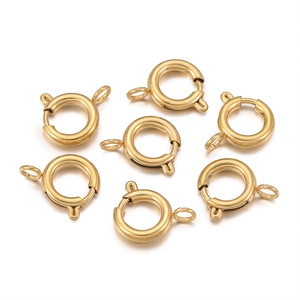 Close-up of golden stainless steel spring ring clasps for jewelry making projects