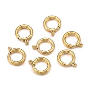 Close-up of golden stainless steel spring ring clasps for jewelry making DIY