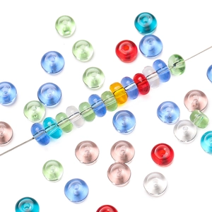 Macro shot of 3x6.5mm colorful glass abacus beads showing smooth texture and transparency