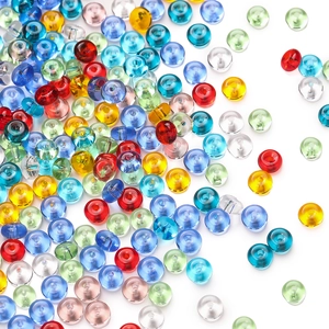 Macro view of multi-colored translucent glass mushroom beads for DIY jewelry making