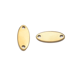 Detailed macro view of golden oval stainless steel charms with dual connection holes