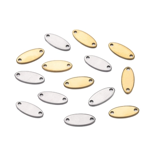 Detailed macro view of oval stainless steel tags with brushed finish and dual holes