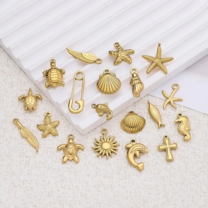 Various 18K gold-plated stainless steel sea creature and sun charms for DIY jewelry making
