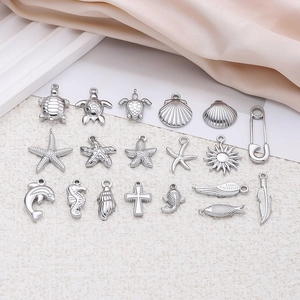 Polished stainless steel ocean charms set featuring sea turtle starfish and shell shapes