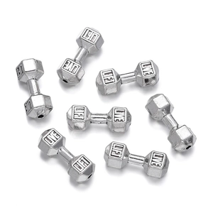Detailed view of silver dumbbell spacer beads with engraved Live and Lift text for jewelry