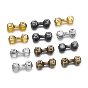 Macro detail of alloy dumbbell spacer beads with engraved Live and Lift text for DIY jewelry