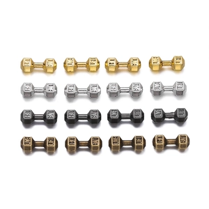 Macro detail of dumbbell shaped alloy spacer beads with Live Lift engraved lettering