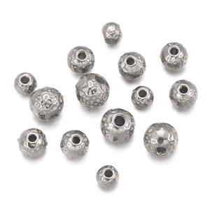 Macro detail of silver hammered texture stainless steel beads with holes for DIY jewelry