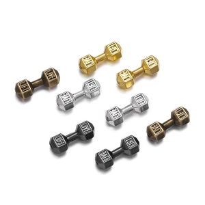 Macro detail of alloy dumbbell spacer beads with Live Lift engraving for jewelry DIY