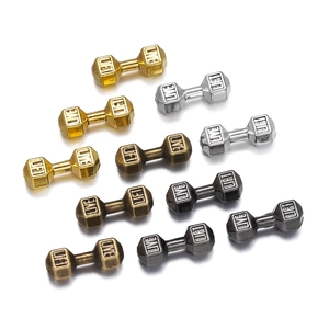 Macro shot of 1.6mm hole barbell beads with LIVE LIFT engraving in four metal finishes