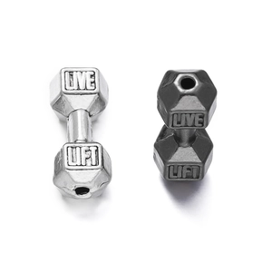 Close-up of dumbbell-shaped alloy spacer beads with Live Lift engraving for DIY jewelry