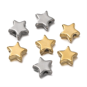 Detailed view of star-shaped stainless steel spacer beads in gold and silver finish