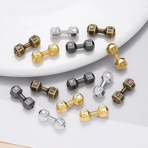 Five dumbbell spacer beads in gold, silver, bronze, and black finishes for DIY jewelry
