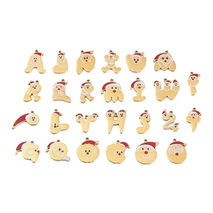 Macro view of 26 gold-plated Christmas alphabet charms with red enamel Santa details
