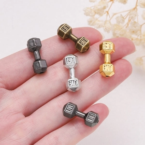Macro shot of alloy dumbbell spacer beads with Live Lift engraving for DIY jewelry