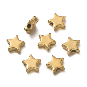 Detailed view of gold star spacer beads with smooth polished finish for jewelry making