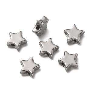 Macro detail of star shaped stainless steel spacer beads for DIY jewelry making