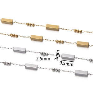 Macro view of gold and silver chain components with 9.5mm rectangle and 2.5mm beads