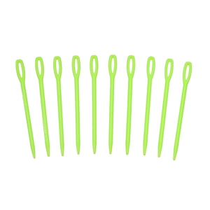 Macro detail of 10 green plastic sewing needles with large eye for easy threading