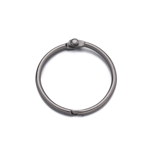 Macro shot of gunmetal plated hinge ring for DIY crafts showing functional locking clasp