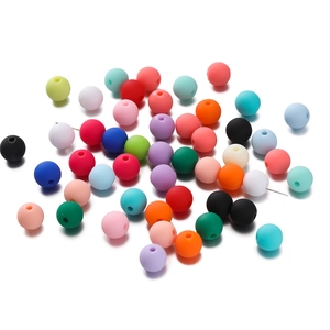 Detailed macro shot of 6mm mixed color matte acrylic beads for DIY jewelry making