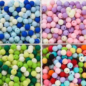 Detailed top view of 6mm matte acrylic beads in diverse colors for DIY craft jewelry
