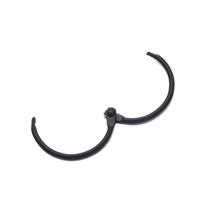 Detail of open matte black metal binder ring with a central hinge on white background