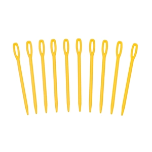 Close-up of ten large-eye yellow plastic needles arranged for knitting and DIY sewing