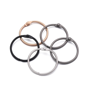 Macro detail of multicolored 30mm metal hinged binder rings for DIY crafts and keychains
