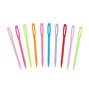 Detailed view of colorful large-eye plastic sewing needles in various vibrant shades