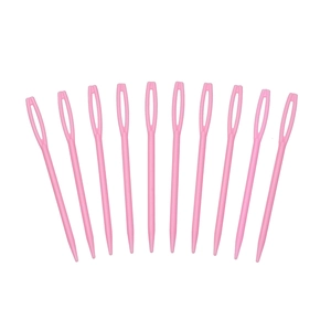 Close-up of pink plastic large-eye sewing needles set for yarn weaving and DIY crafts