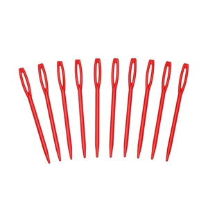 Detailed close-up of ten large-eye red plastic sewing needles in a fan-shaped arrangement