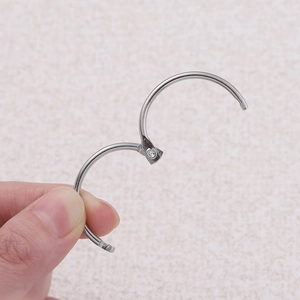 Detail of silver hinged metal loose leaf ring in open position for DIY binding