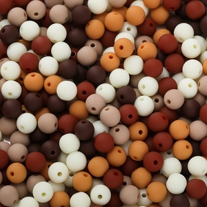 Macro shot of 6mm matte finish acrylic beads in mixed earth tones for DIY jewelry making