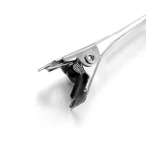 Macro view of silver alligator clip hinge and high-tension spring for DIY hair accessories