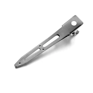 Macro view of brushed stainless steel hair clip with hollow cut-out and rounded tail