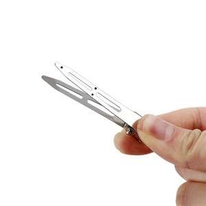 Silver metal duckbill hair clip with cutout design held by hand for DIY hair accessories