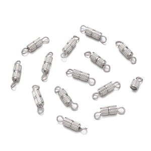 Macro view of silver barrel screw clasps with vertical texture for jewelry making