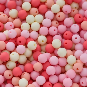 Macro shot of 6mm colorful matte acrylic beads with holes for DIY jewelry making
