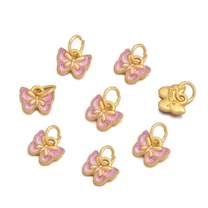 Macro detail of eight purple butterfly enamel charms with golden metal edges and rings