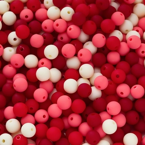 Detailed macro shot of multi-colored matte 6mm acrylic beads for DIY jewelry making