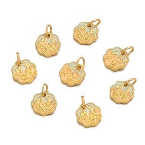 Close-up of golden enamel DIY charms with auspicious Chinese characters and patterns