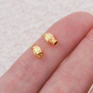Macro shot of vertical textured brass screw clasps for DIY necklace and jewelry making