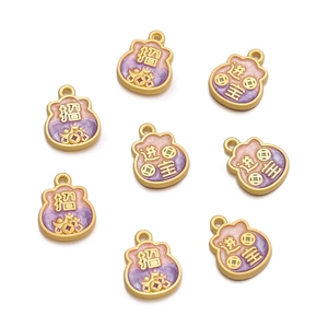 Detailed view of eight pink and purple enamel lucky pouch pendants with gold-plated edges