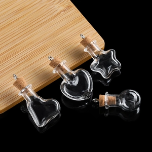 Detailed view of DIY mini glass wishing bottles in various shapes with cork stoppers