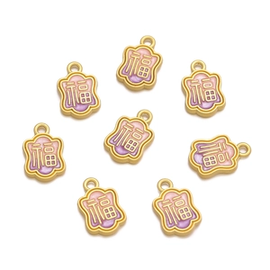 Macro view of eight pink and purple enamel Fu charms with gold alloy for jewelry DIY
