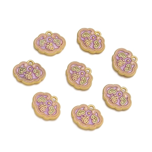 Detailed macro of golden alloy longevity lock pendants with purple enamel and Fu character