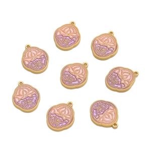 Detailed view of pink and purple lotus flower enamel charms with golden metal edges