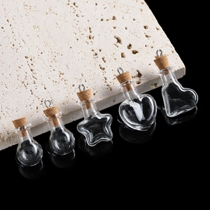 Set of five mini clear glass DIY wish bottles with cork stoppers and metal hanging rings